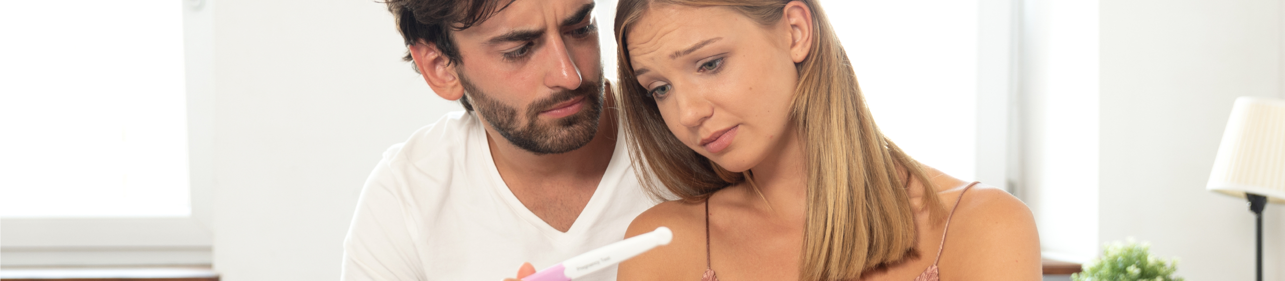 Couple trying to have a baby. Having problems in bedroom concept. Negative pregnancy test result